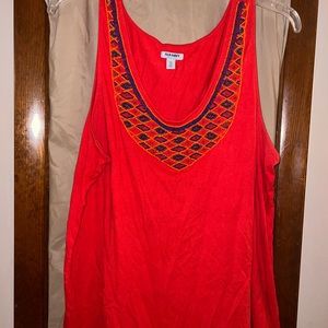 Beaded embroidery on red cotton tank/tunic.